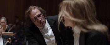 Movie still from “Tár” (2022), directed by Todd Field – A man and a woman are talking to each other; Close Up shot, Over the shoulder angle