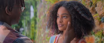 A young girl is looking into the distance
