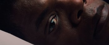 Movie still from “Unbreakable” (2000), directed by M. Night Shyamalan – View of a person's eye; Extreme Close Up shot, Overhead angle