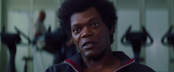 Movie still from “Unbreakable” (2000), directed by M. Night Shyamalan – A person wearing a jacket; Close Up shot, Low angle