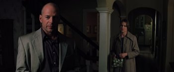 Movie still from “Unbreakable” (2000), directed by M. Night Shyamalan – A man and a woman standing in front of each other; Medium shot, Over the shoulder angle