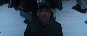 Movie still from “Unbreakable” (2000), directed by M. Night Shyamalan – A person wearing a hat; Close Up shot, Low angle