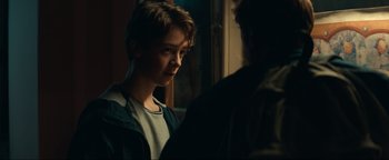 Movie still from “Uncharted” (2022), directed by Ruben Fleischer – A young man standing next to another young man; Close Up shot, Over the shoulder angle