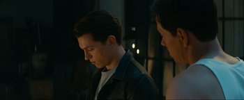 Movie still from “Uncharted” (2022), directed by Ruben Fleischer – A man and a woman standing next to each other; Close Up shot, Over the shoulder angle