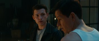 Movie still from “Uncharted” (2022), directed by Ruben Fleischer – A man and a woman are talking to each other; Close Up shot, Over the shoulder angle