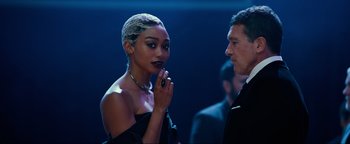 Movie still from “Uncharted” (2022), directed by Ruben Fleischer – A man and a woman standing next to each other; Medium shot, Over the shoulder angle