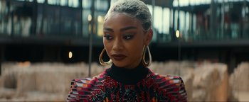 Movie still from “Uncharted” (2022), directed by Ruben Fleischer – A person wearing a dress; Close Up shot, Over the shoulder angle