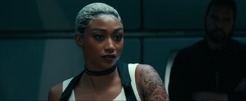 Movie still from “Uncharted” (2022), directed by Ruben Fleischer – A person with a tattoo on their arm; Close Up shot, Over the shoulder angle