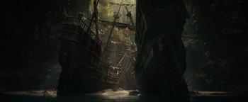Movie still from “Uncharted” (2022), directed by Ruben Fleischer – A boat in the middle of the water; Extreme Wide shot, Low angle