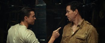 Movie still from “Uncharted” (2022), directed by Ruben Fleischer – A man and a woman talking to each other; Close Up shot, Over the shoulder angle