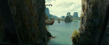 Movie still from “Uncharted” (2022), directed by Ruben Fleischer – A boat in the middle of the water; Extreme Wide shot, High angle