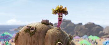Movie still from “Under the Boardwalk” (2023), directed by David Soren – A character with a flower in his head is sitting on top of a barrel; Close Up shot, Low angle