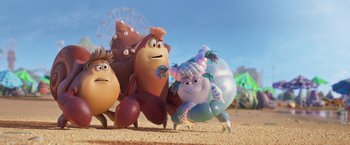 Movie still from “Under the Boardwalk” (2023), directed by David Soren – A group of people that are standing in the sand; Wide shot, Low angle