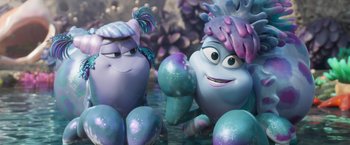 Movie still from “Under the Boardwalk” (2023), directed by David Soren – A couple of characters sitting next to each other in the water; Medium shot, Over the shoulder angle