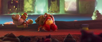 Movie still from “Under the Boardwalk” (2023), directed by David Soren – A stuffed crab is sitting on the ground; Wide shot, Low angle