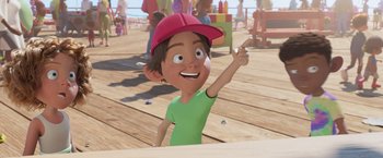 Movie still from “Under the Boardwalk” (2023), directed by David Soren – A cartoon of a boy wearing a hat and pointing; Medium shot, Low angle