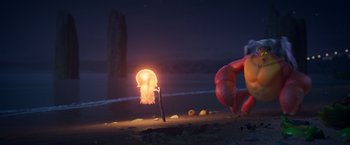 Movie still from “Under the Boardwalk” (2023), directed by David Soren – An image of an octopus and a candle on the beach at night; Extreme Wide shot, Low angle