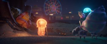 Movie still from “Under the Boardwalk” (2023), directed by David Soren – An image of a jellyfish in the sand at the beach at night; Extreme Wide shot, Low angle