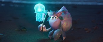 Movie still from “Under the Boardwalk” (2023), directed by David Soren – An image of an animated character holding a jellyfish; Wide shot, High angle