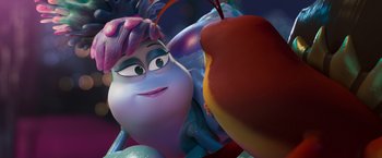 Movie still from “Under the Boardwalk” (2023), directed by David Soren – A person's face with an apple in front of them; Extreme Close Up shot, Over the shoulder angle