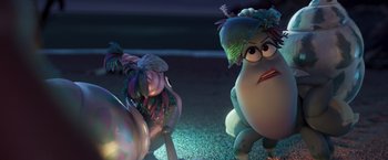 Movie still from “Under the Boardwalk” (2023), directed by David Soren – A couple of cartoon characters sitting next to each other on the ground; Medium shot, Over the shoulder angle