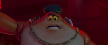 Movie still from “Under the Boardwalk” (2023), directed by David Soren – A character's face with a chain around his neck; Close Up shot, Low angle