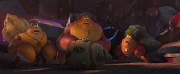 Movie still from “Under the Boardwalk” (2023), directed by David Soren – A group of people that are sitting on some pumpkins; Wide shot, Low angle