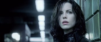 Movie still from “Underworld” (2003), directed by Len Wiseman – A person with wet hair; Close Up shot, Low angle