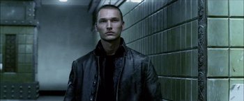Movie still from “Underworld” (2003), directed by Len Wiseman – A man wearing a leather jacket standing next to a brick wall; Close Up shot, Low angle