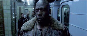 Movie still from “Underworld” (2003), directed by Len Wiseman – A person wearing a jacket; Close Up shot, Low angle