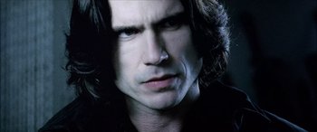 Movie still from “Underworld” (2003), directed by Len Wiseman – A person with long dark hair; Close Up shot, High angle