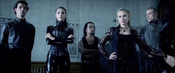 Movie still from “Underworld” (2003), directed by Len Wiseman – A man and two women standing next to each other; Medium shot, Low angle