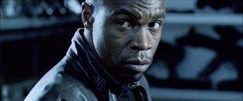 Movie still from “Underworld” (2003), directed by Len Wiseman – A person wearing a leather jacket; Close Up shot, Over the shoulder angle