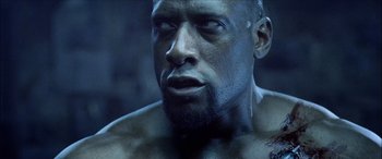 Movie still from “Underworld” (2003), directed by Len Wiseman – A man's face in the dark; Close Up shot, Low angle