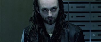 Movie still from “Underworld” (2003), directed by Len Wiseman – A person with long hair; Close Up shot, Low angle