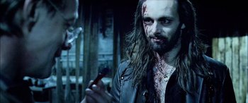 Movie still from “Underworld” (2003), directed by Len Wiseman – A person holding a cell phone; Close Up shot, Over the shoulder angle