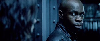 Movie still from “Underworld” (2003), directed by Len Wiseman – A person wearing a leather jacket; Close Up shot, Over the shoulder angle
