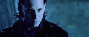 Movie still from “Underworld” (2003), directed by Len Wiseman – A person wearing a black shirt; Close Up shot, Low angle