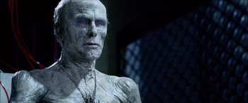 Movie still from “Underworld” (2003), directed by Len Wiseman – An old man with blue eyes is posing for a picture; Close Up shot, Low angle