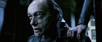 Movie still from “Underworld” (2003), directed by Len Wiseman – A person with a knife in his hand; Close Up shot, High angle