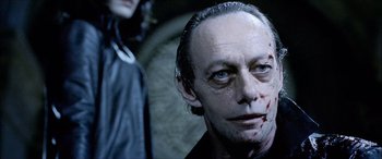 Movie still from “Underworld” (2003), directed by Len Wiseman – A person with blood on his face; Close Up shot, Over the shoulder angle