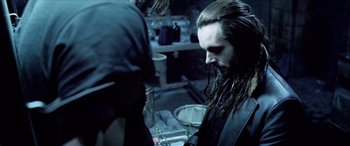 Movie still from “Underworld” (2003), directed by Len Wiseman – A man with long black hair and long beard; Close Up shot, Over the shoulder angle