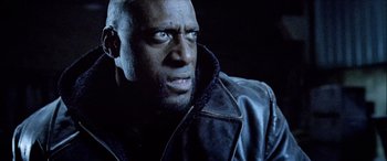 Movie still from “Underworld” (2003), directed by Len Wiseman – A person wearing a leather jacket; Close Up shot, Low angle