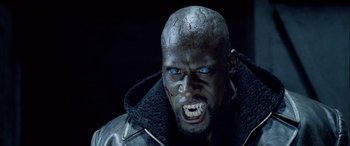 Movie still from “Underworld” (2003), directed by Len Wiseman – A person wearing a leather jacket; Close Up shot, Low angle