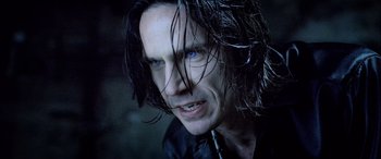 Movie still from “Underworld” (2003), directed by Len Wiseman – A person with long hair; Close Up shot, Over the shoulder angle