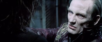Movie still from “Underworld” (2003), directed by Len Wiseman – A person wearing a leather jacket; Close Up shot, Over the shoulder angle