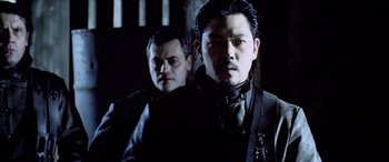 Movie still from “Underworld” (2003), directed by Len Wiseman – Two men standing next to each other in a dark room; Close Up shot, Low angle