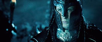 Movie still from “Underworld: Evolution” (2006), directed by Len Wiseman – A person wearing a helmet; Close Up shot, Over the shoulder angle