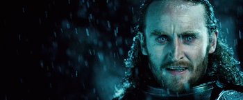 Movie still from “Underworld: Evolution” (2006), directed by Len Wiseman – A man's face in the rain; Close Up shot, Over the shoulder angle