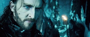 Movie still from “Underworld: Evolution” (2006), directed by Len Wiseman – A person with blue eyes; Close Up shot, Over the shoulder angle